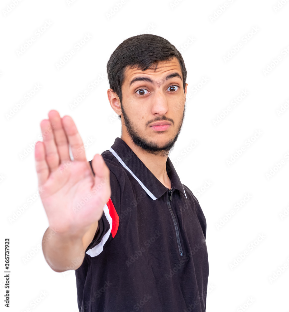 Arabic guy raising his hand as a symbol to stop someone Arabic guy raising his hand as a symbol to stop someone