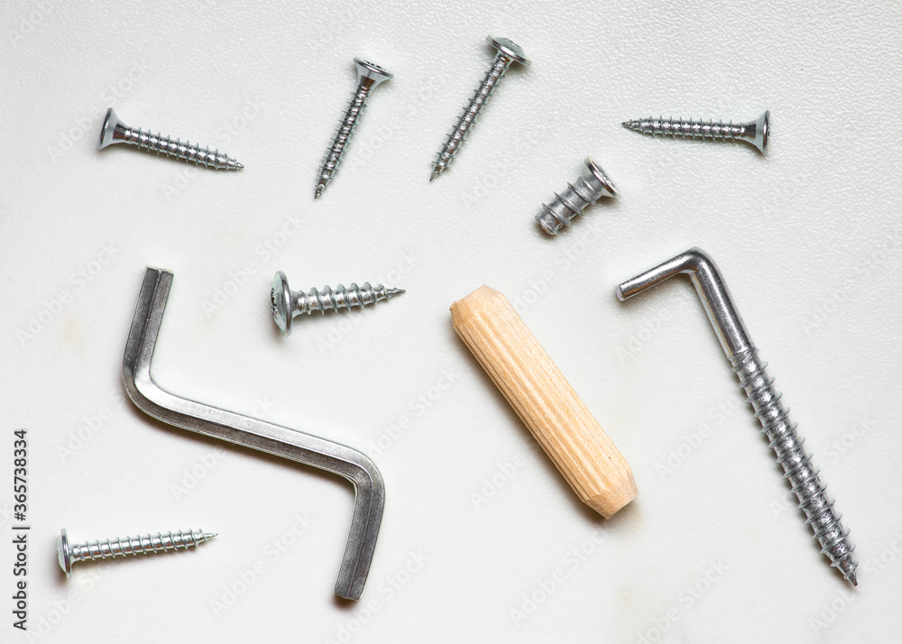 screws and bolts on white table 