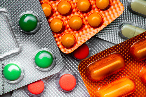 colorful round tablets and capsules 