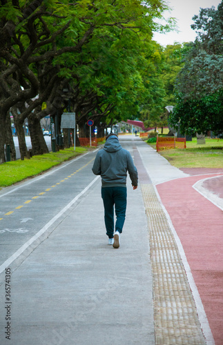 Wallpaper Mural Man walking doing exercises in a city park Torontodigital.ca