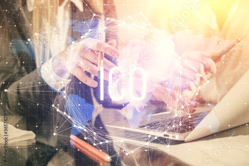 Wallpaper Mural Double exposure of man and woman working together and crypto finance theme hologram. Blockchain business concept. Computer background. Torontodigital.ca