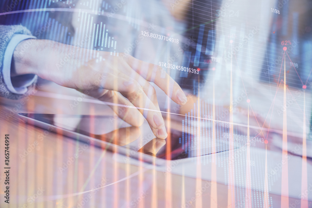 Double exposure of forex graph drawing and man and woman working together holding and using a mobile device. Trade concept. Double exposure of forex graph drawing and man and woman working together holding and using a mobile device. Trade concept.