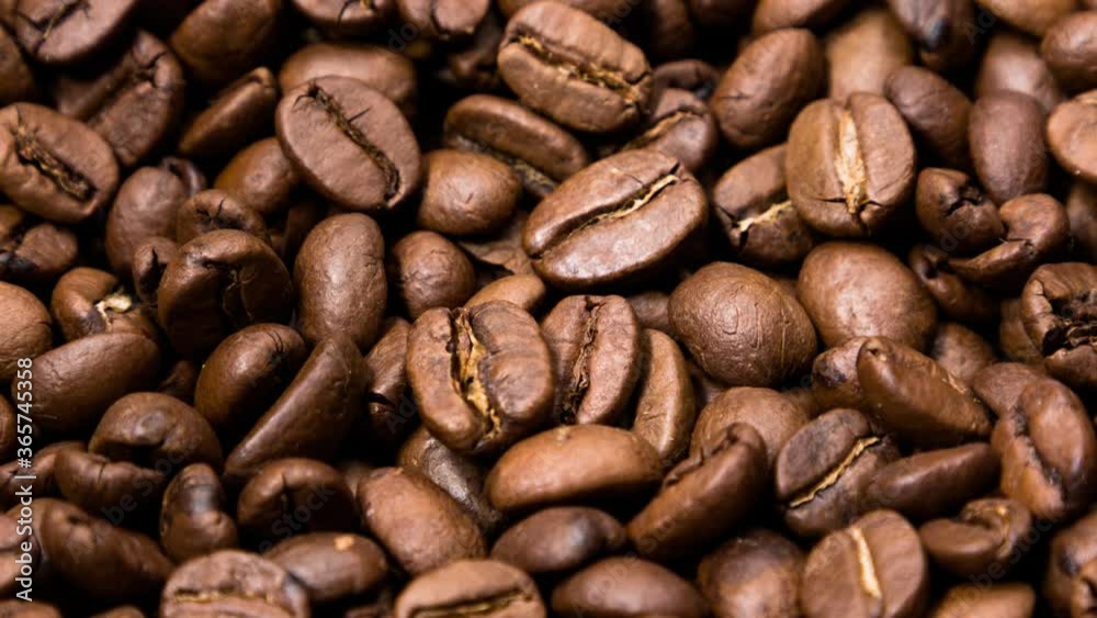 Rotating fresh roasted coffee beans, seamless loop Rotating fresh roasted coffee beans, seamless loop