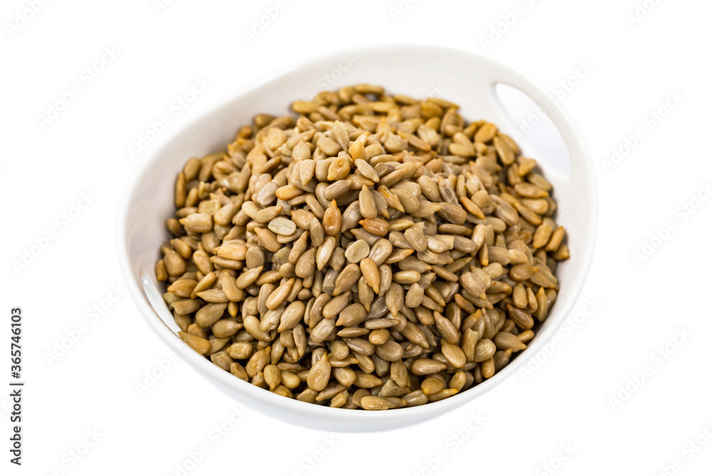Sunflower Kernels Roasted Seeds Isolated on White Background. Selective focus. Sunflower Kernels Roasted Seeds Isolated on White Background. Selective focus.