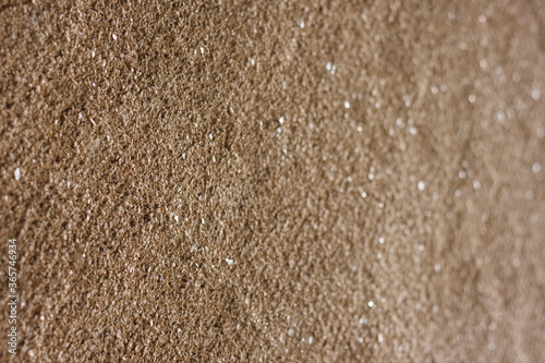 Texture of decorative plaster with a relief. Abstract background. Small depth of field. Close-up