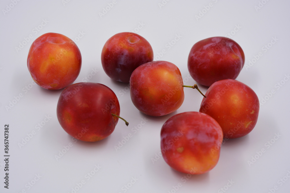 Red, cherry early variety of cherry plum early, which grows and grows on the territory of Ukraine. Delicious sweet summer fruits, fresh and healthy fruits in the human diet. Red, cherry early variety of cherry plum early, which grows and grows on the territory of Ukraine. Delicious sweet summer fruits, fresh and healthy fruits in the human diet.