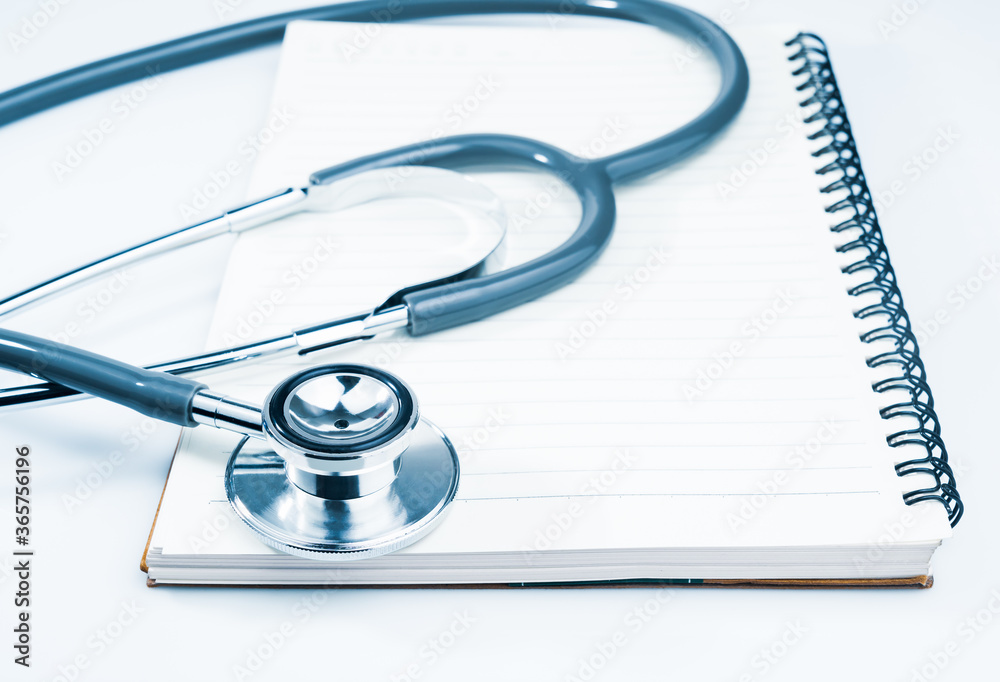 Medical stethoscope on blank notepad Medical stethoscope on blank notepad