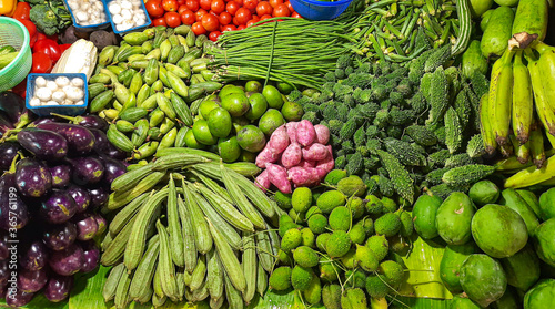 Fototapeta Naklejka Na Ścianę i Meble -  Fresh green vegetables on display for sale at a street market store at Kolkata India