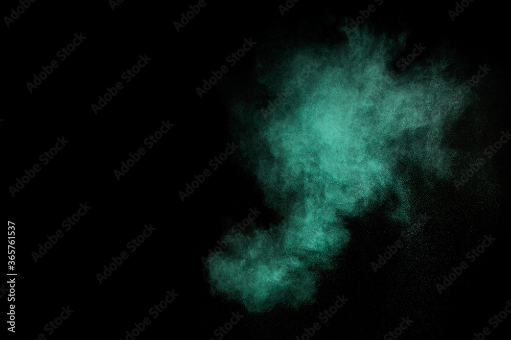 Aquamarine powder explosion on black background. Colored powder cloud. Colorful dust explode. Paint  Holi.