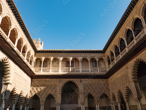 The Royal Alcázars of Seville, historically known as al-Qasr al-Muriq and commonly known as the Alcázar of Seville, is a royal palace in Seville, Spain, built for the Christian king Peter of Castile