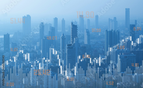Obraz na plátně investment financial city with stock market graph