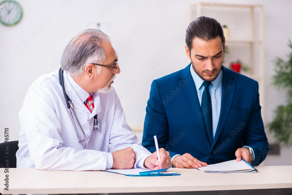 Male doctor and businessman discussing medical project Male doctor and businessman discussing medical project