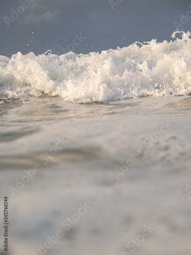 Waves breaking off the coast of a small rural town, New Zealand. 