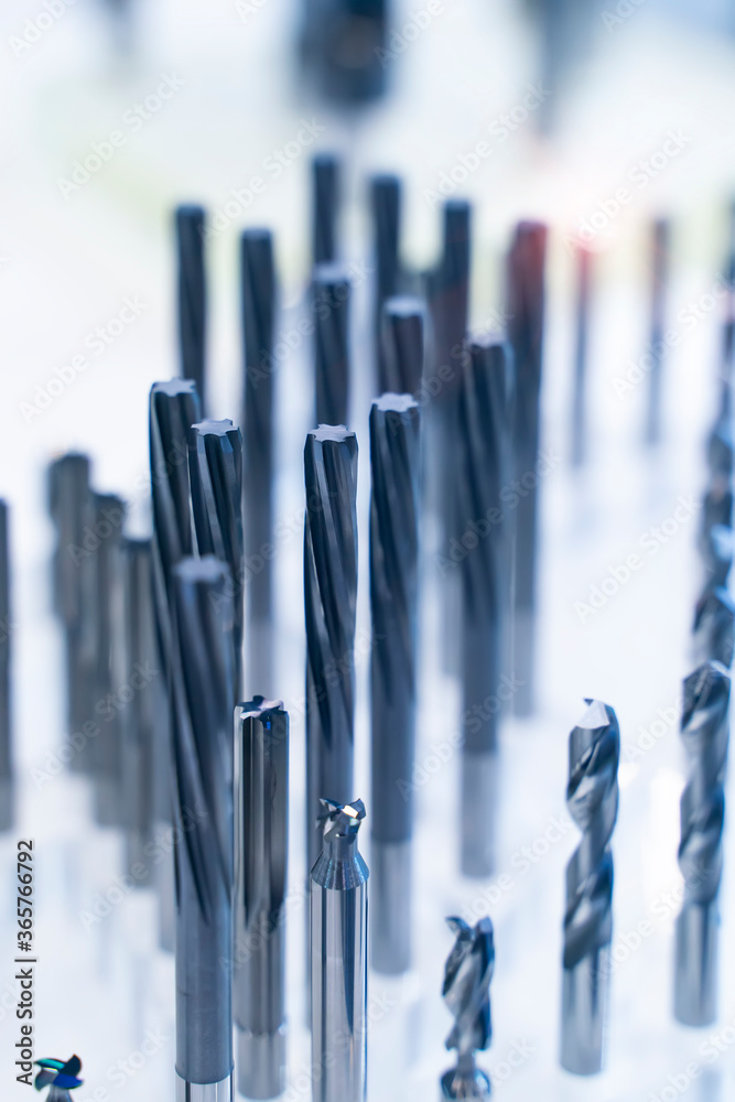 automatic heavy industrial drill bit cutting the metal block at the factory automatic heavy industrial drill bit cutting the metal block at the factory