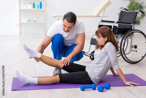 Leg injured woman doing sport exercises with personal coach