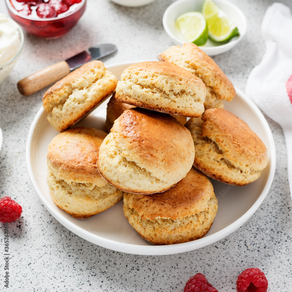 Scones with raspberry jam and clotted cream.