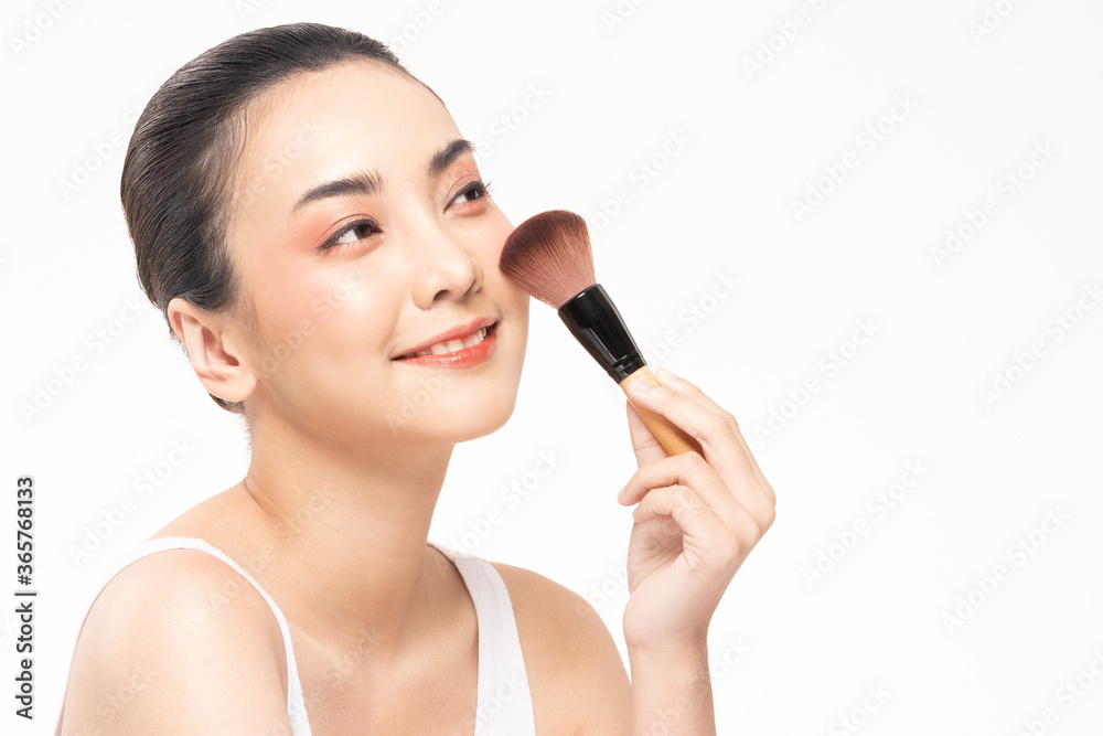 Beauty asian woman hold make up brush and cheerful with make up brush Beauty asian woman hold make up brush and cheerful with make up brush