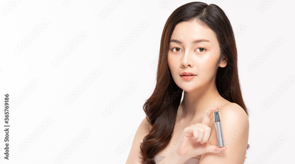 Beauty asian woman hold bottle cosmetic cream lotion  and cheerful.