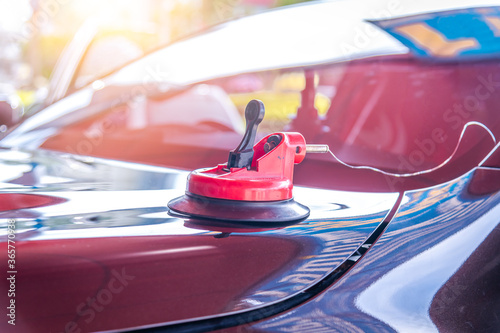 Mechanic car service changing windshield of a car mirror by used technology replacing new windscreen or windshield  photo