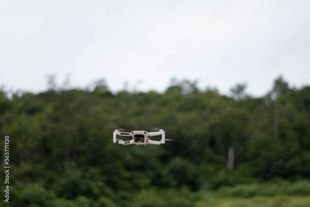 Naklejka premium drone camera in the sky near the forest.