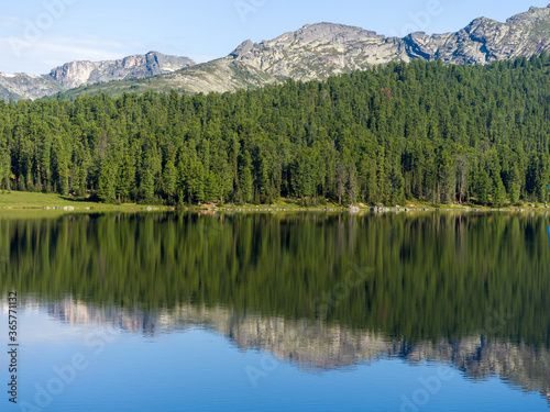 Lake in the wild. Coniferous forests of Siberia. Ergaki Nature Park
