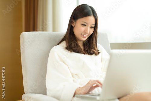 Pretty young girl using laptop indoors Free Download Pretty young girl using laptop indoors - GFXLoad
