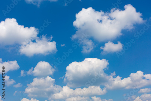 White clouds on blue sky background.