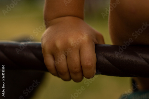 Child arm hold iron thing