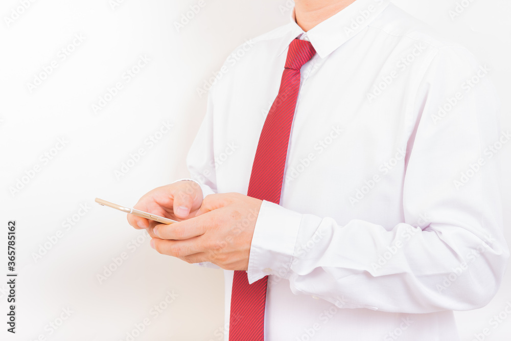 Smartphone, man in white suit with red necktie using new smartphone with white background