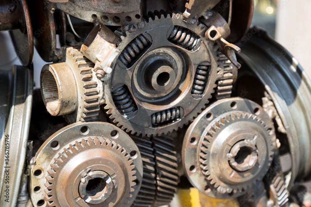 Robot made of metal parts and assemblies. Metal components and parts are arranged in the shape of robot. Robot made of metal parts and assemblies. Metal components and parts are arranged in the shape of robot.