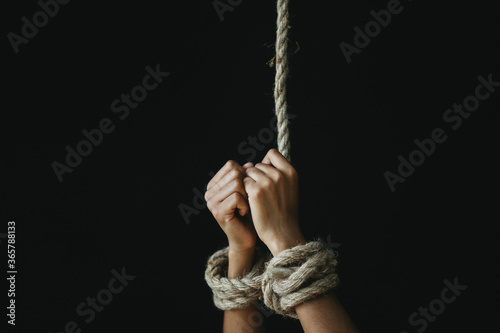 hands tied with rope