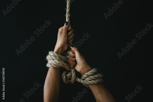 hands tied with rope