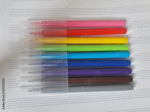 colored markers on a white background