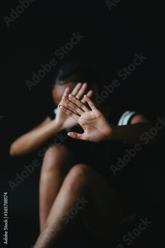 young woman with hands on her face