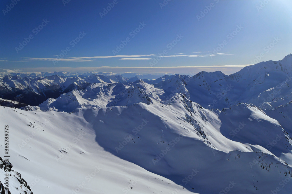 Fototapeta premium Austrian Alps covered with fresh snow during sunny winter day in Obergurgl, Austria.