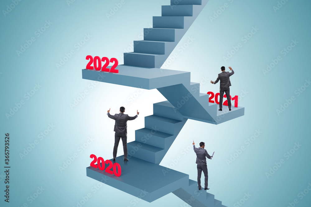 Businessman climbing stairs on yearly basis Businessman climbing stairs on yearly basis