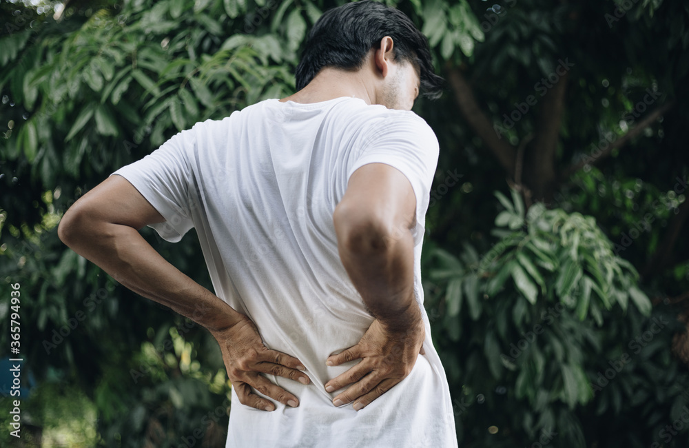 Fototapeta premium Young asian man feel pain on her back , health care concep