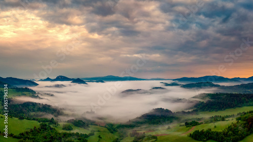 beautiful landscape with valleys  lakes and rivers in fog
