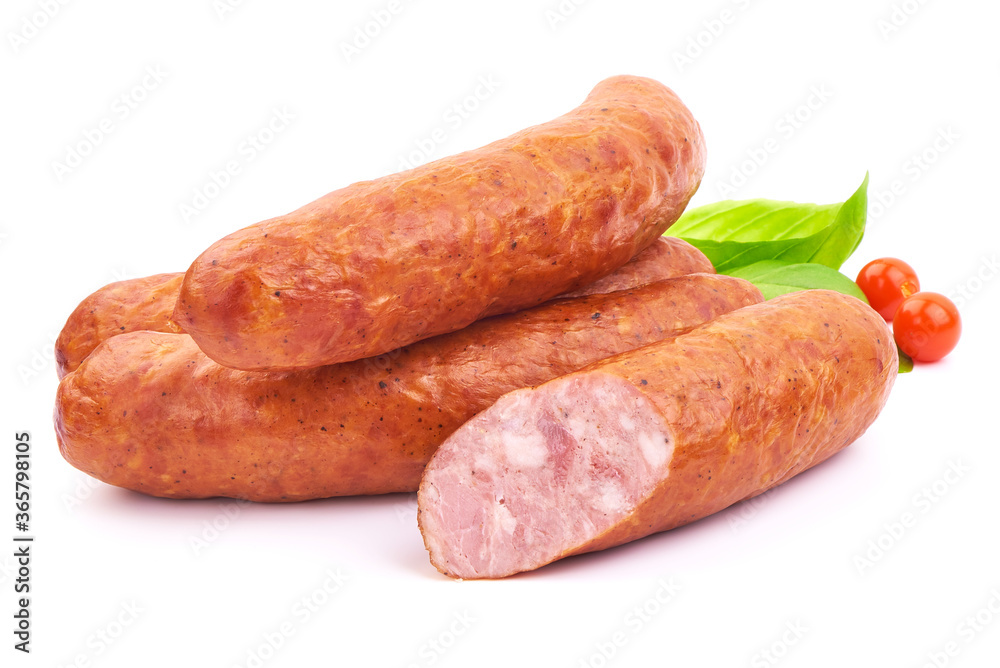 Delicious Smoked Sliced Sausages with Basil leaves, isolated on a white background. Close-up. Delicious Smoked Sliced Sausages with Basil leaves, isolated on a white background. Close-up.