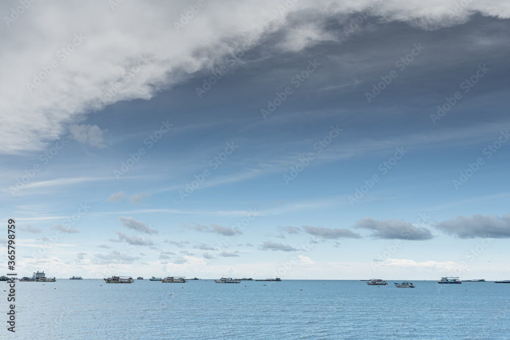 Blue Cloudy Sky in daylight with ship on the sea /background texture/ copy space