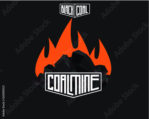 Pile of burning coal charcoal, graphite coal,lump of coal with flames isolated on black