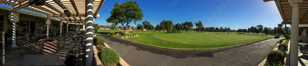 Panoramic view of a golf club in Lake San Marcos. There is a restaurant inside the golf club.