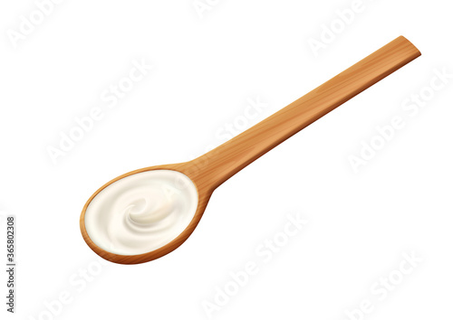 White cream in a wooden spoon, sour cream, mayonnaise or yoghurt, milk sauce, dairy products.