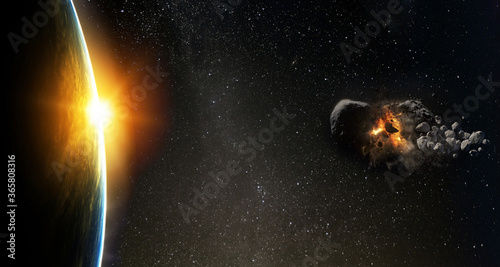Asteroid flies near the earth orbit. Meteorite approaching Earth.  Elements of this image furnished by NASA.