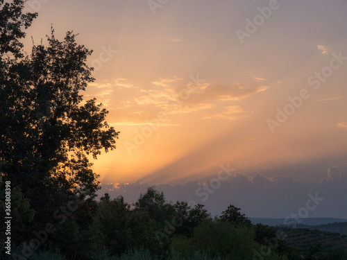 Orange and blue sky sunset in the countryside photo