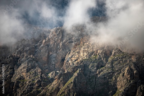 Rocky Caucasus ridge in Ingushetia, Russia. Light clouds.