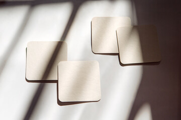coasters under the sun with shadows