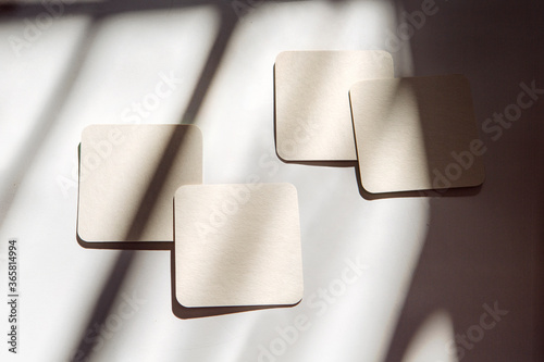 coasters under the sun with shadows