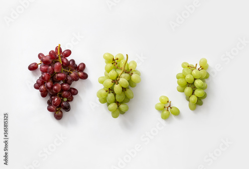 three bunces of red and white grapes photo