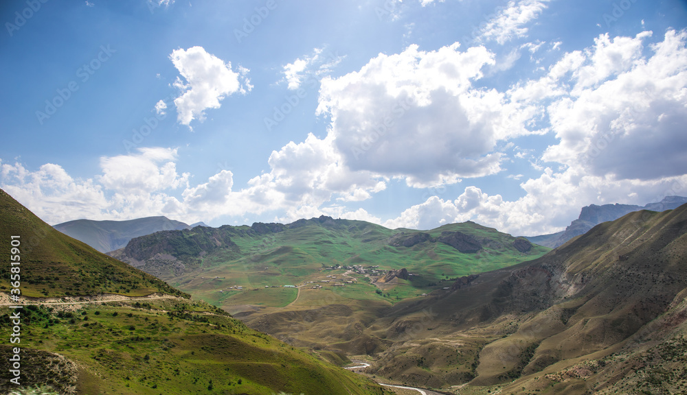 Beautiful landscape in the mountains at summer in daytime. Mountains at the sunset time. Azerbaijan, Caucasus. Khinalig Beautiful landscape in the mountains at summer in daytime. Mountains at the sunset time. Azerbaijan, Caucasus. Khinalig